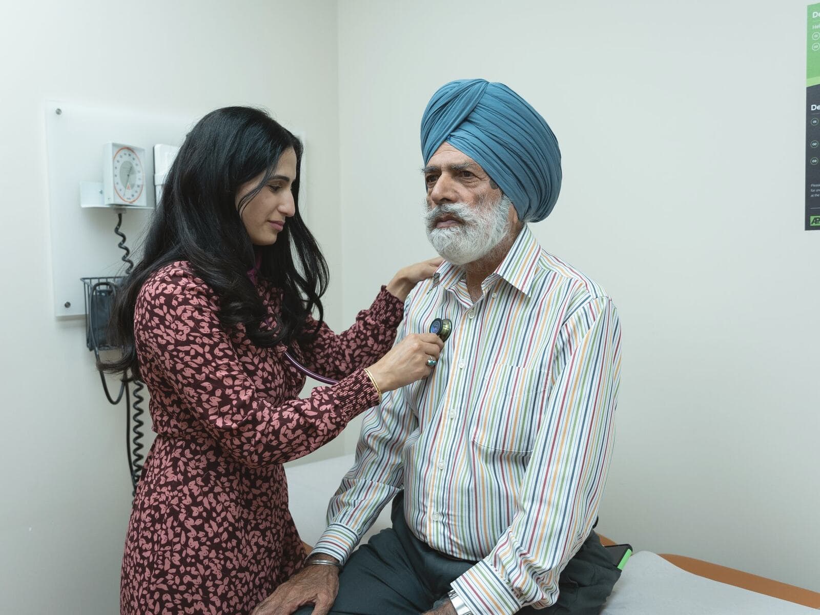 A Healtree doctor examining an elderly patient